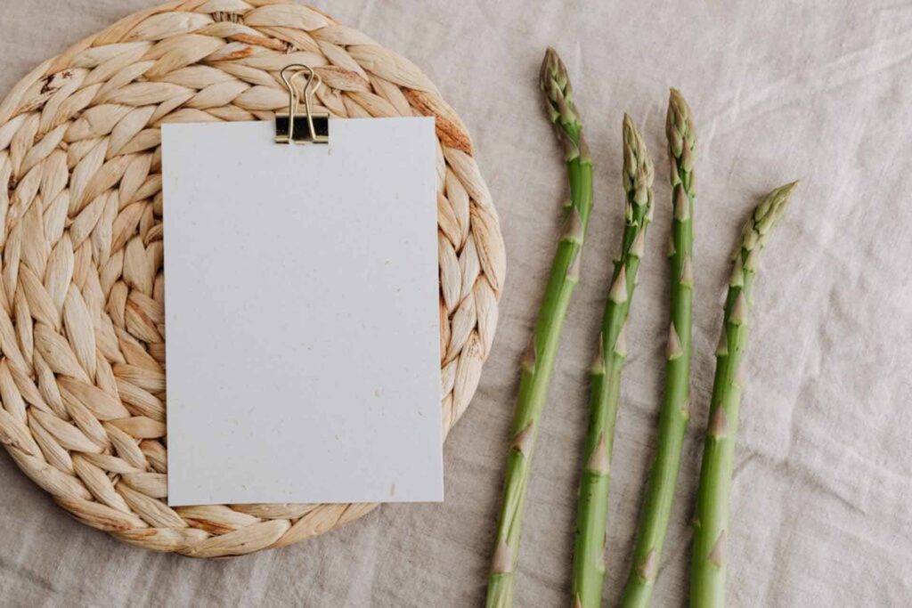 Asparagus next to blank recipe card