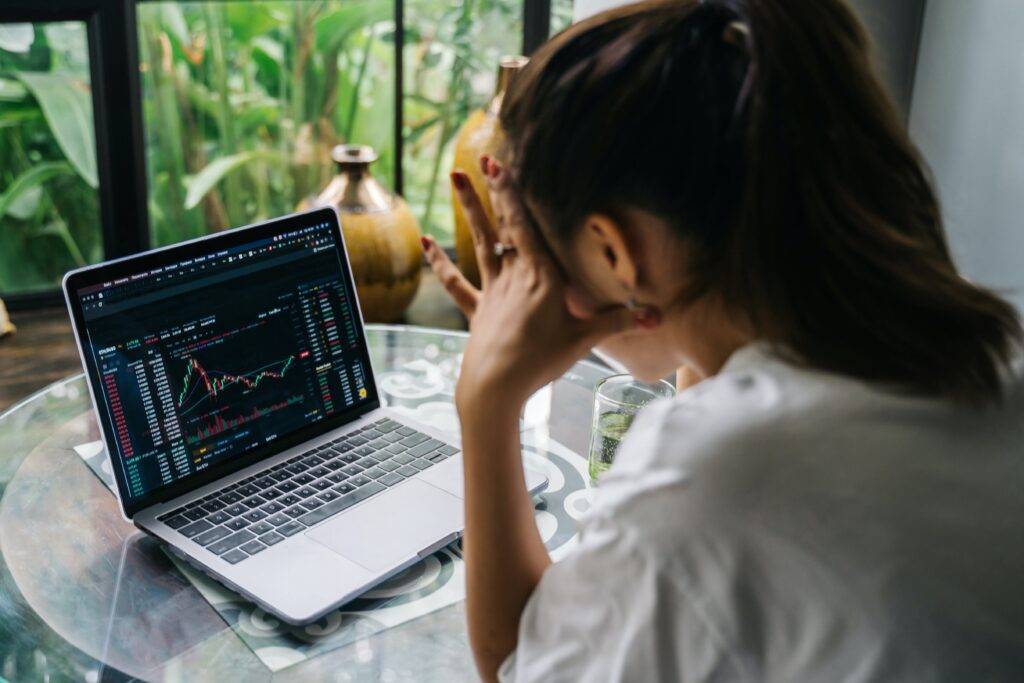 A female at a laptop working on Blockchain Process Documentation Services.