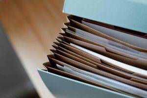 a folder of files, representing the importance of a business requirements document
