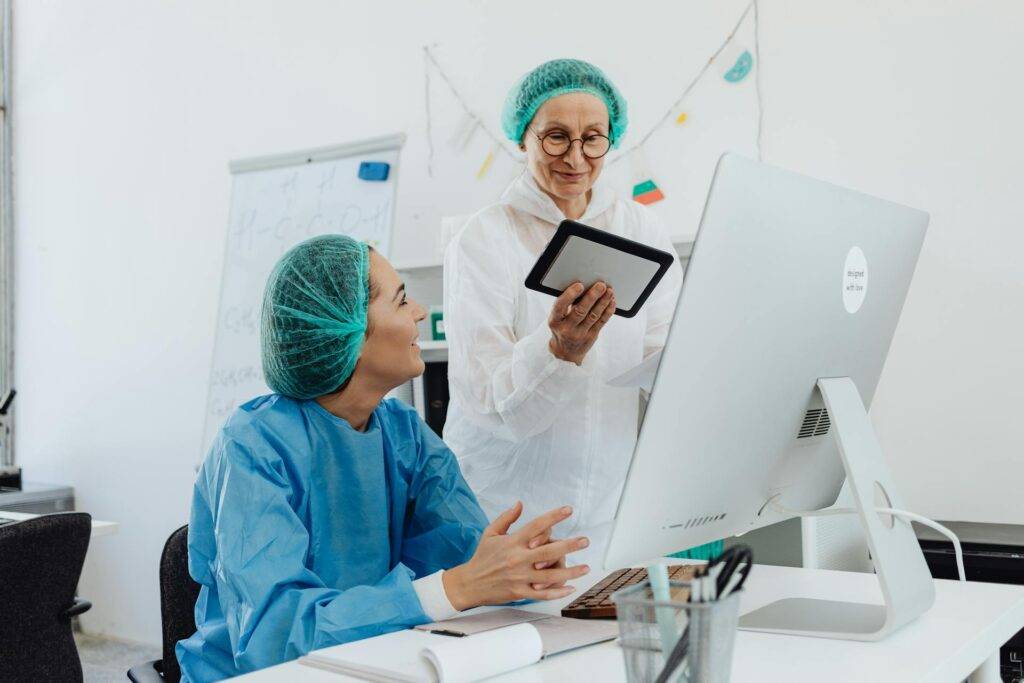 two Medical Researchers Looking Over Results, which are Best Communicated by a Medical Writer