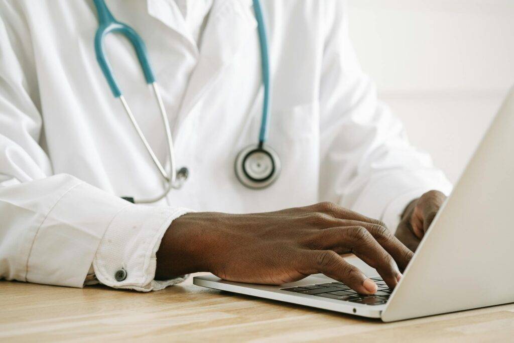 a Medical Writer typing on a Laptop