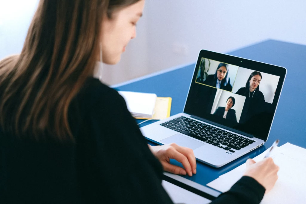 A Businessperson in a Suit on a Video Call, Representing the Importance of Medical Writing and Regulatory Writing in the Healthcare and Pharmaceutical Industries