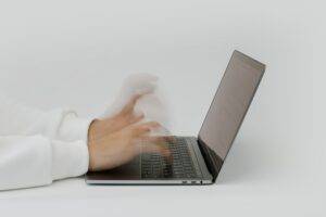 a person typing on a computer about automation technology