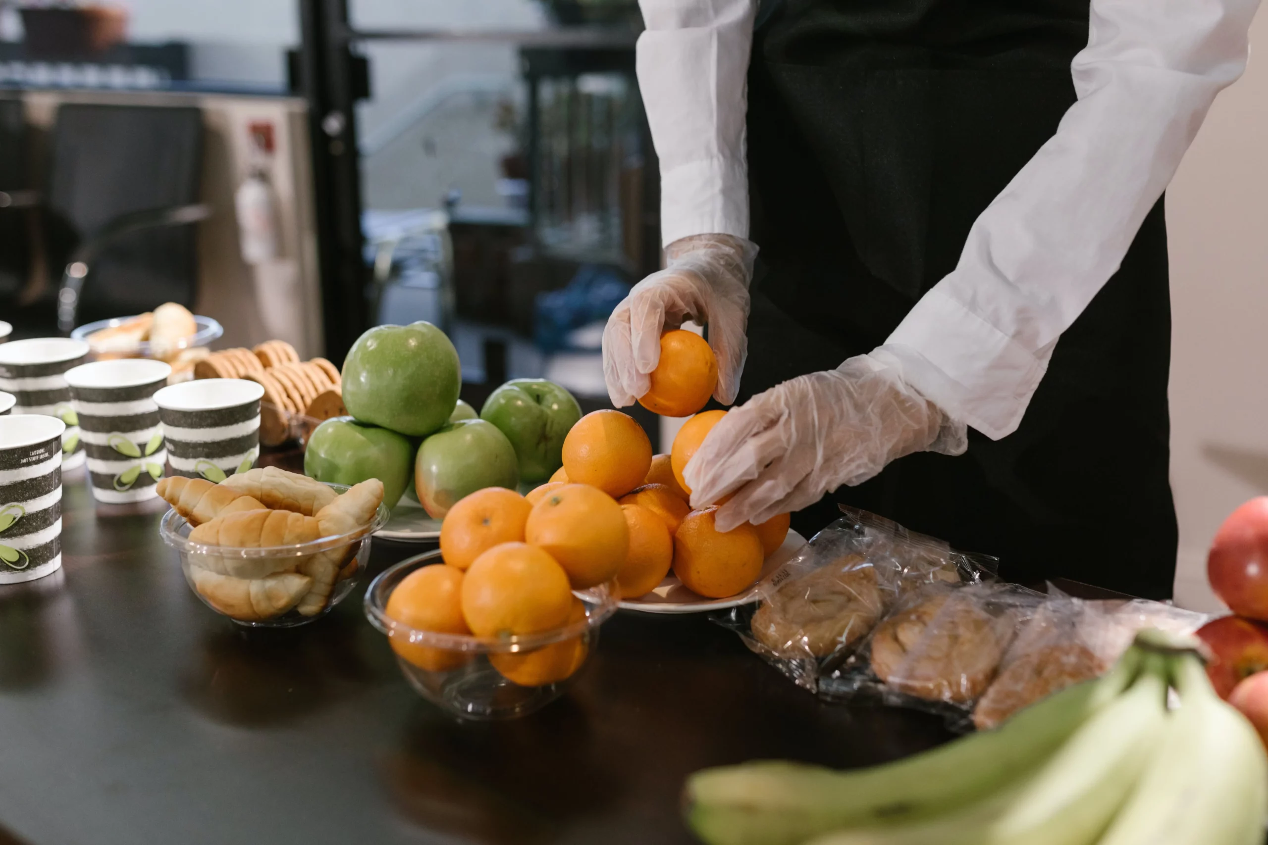 A person handling fruits, representing the importance of a restaurant operations manual.