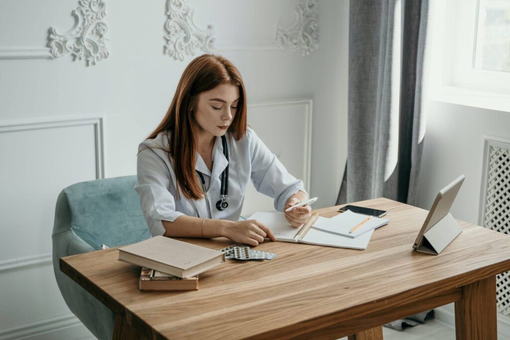 A Female Medical Writer working at a desk, representing the importance of Medical Writing