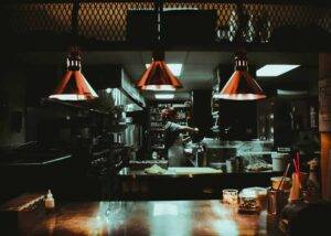 a restaurant at night, representing the importance of restaurant operations manuals for success in the food industry
