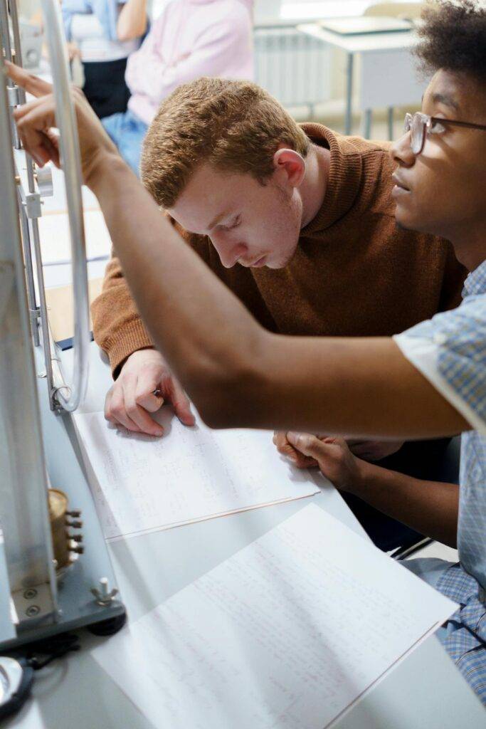 two Scientists working on an Experiment, Representing the Importance of Scientific Writing in Generating Knowledge