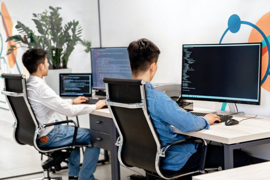 Programmers Working with Coding on a Computer