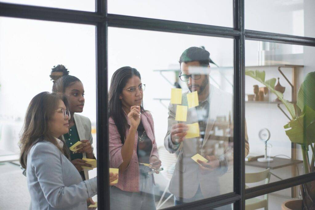 a Group of Employees Trying to Piece Together Business Process Documentation