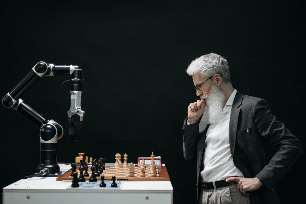 a Man Playing Chess with a Robot, Representing the Tension Between AI and Technical Writers