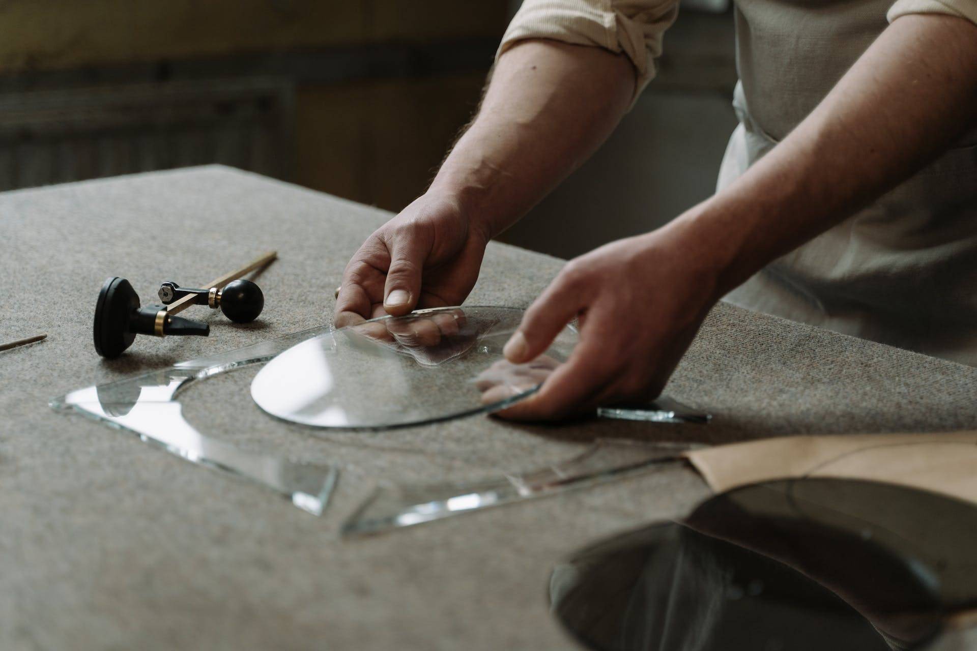 a Craftsman Working with Glass, Representing the Importance of Technical Writers in Developing User Guides and Maintenance Manuals