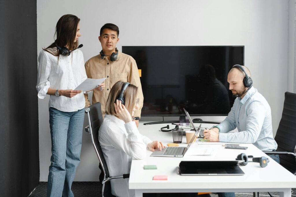 a Group of People looking Confused in a Conference Room, Representing the Importance of Knowing What to Include in Business Requirements Documentation